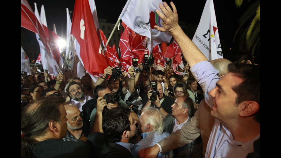 Alexis Tsipras, the head of Greece's leftist Syriza party, greets supporters after a second-place finish on Sunday. He vowed to continue fighting against restrictive European bailouts.