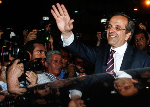New Democracy leader Antonis Samaras hails his victory in Sunday's Greek elections. Samaras' party supports staying in the Euro and maintaining the austerity measures.