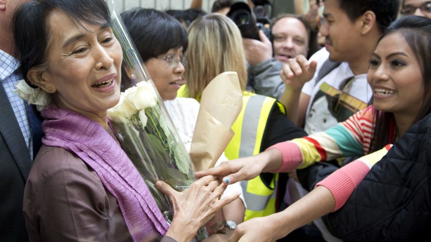 Aung San Suu Kyi is greeted by supporters at the London School of Economics (LSE) in London on June 19, 2012. 