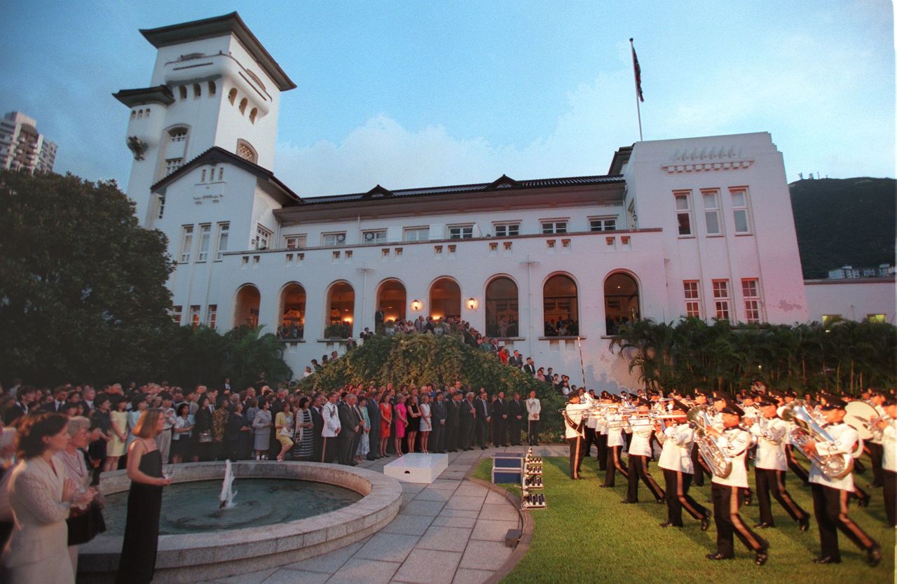 British police troops perform in a "Beating the Retreat" ceremony on June 28, 1997, at Government House, the residence of outgoing Governor Chris Patten. The ceremony was also attended by Prince Charles.