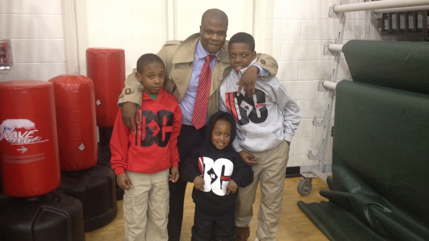 Tony Lewis Jr. poses with Sons of Life members Deerick Banks, left, Kanye Turner, center and Antionio Johnson, Jr., right.