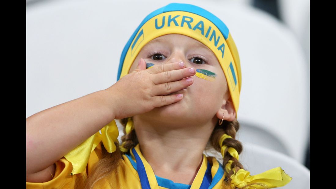 A young Ukraine fan shows enthusiasm ahead of the match between England and Ukraine on Tuesday, June 19. 