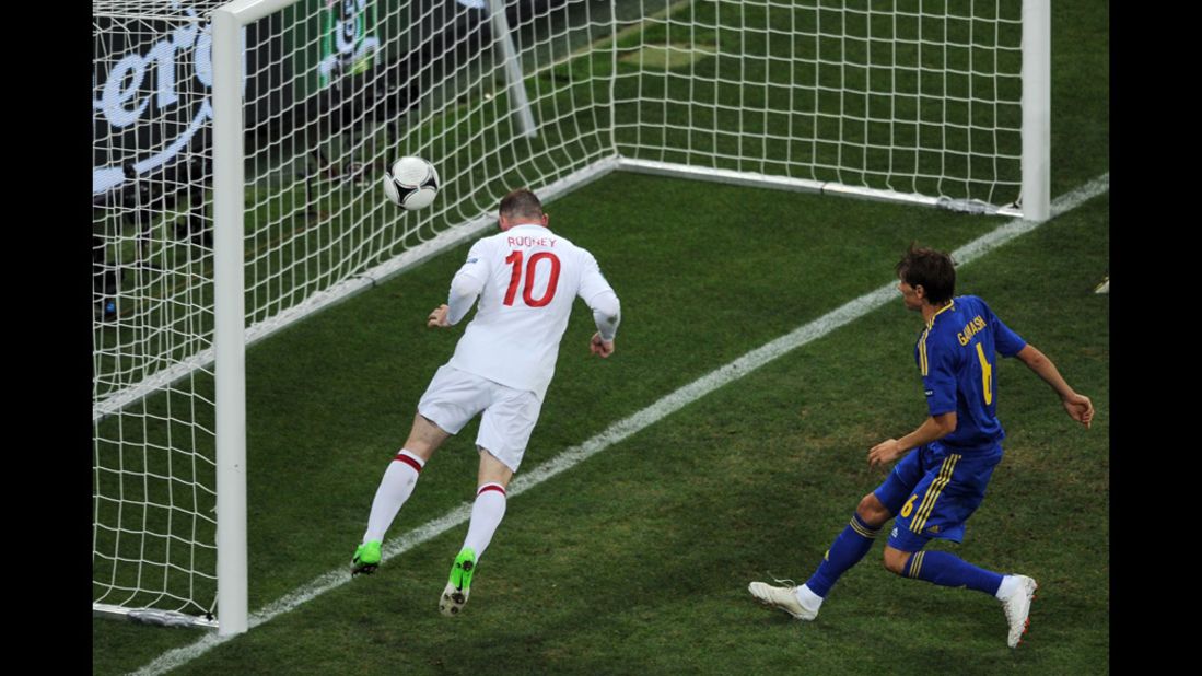 Wayne Rooney of England scores their first goal during the match between England and Ukraine on Tuesday.
