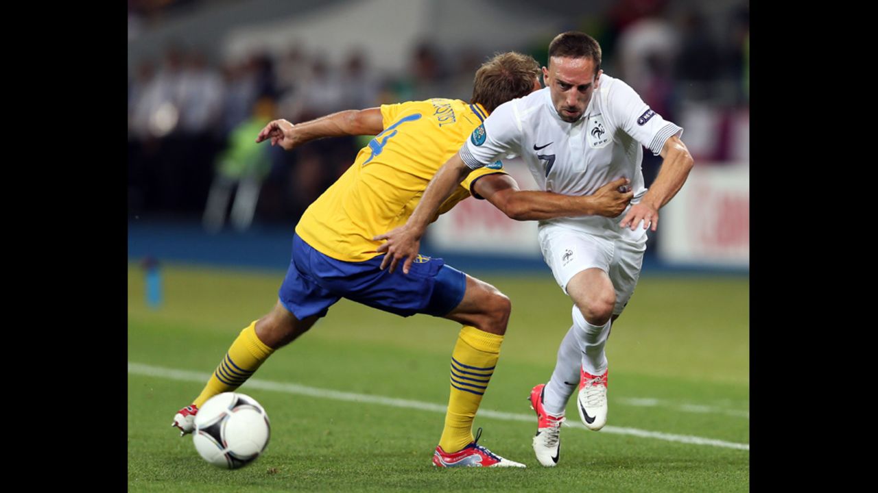 Franck Ribery of France goes past Andreas Granqvist of Sweden during the match between Sweden and France.