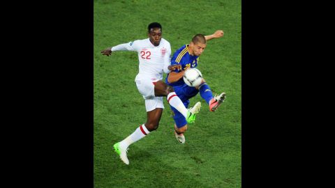 Yaroslav Rakytskyy of Ukraine and Danny Welbeck of England compete for the ball during the match between England and Ukraine.
