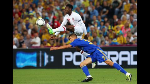 Danny Welbeck of England beats Yevhen Khacheridi of Ukraine to the ball during the match between England and Ukraine.