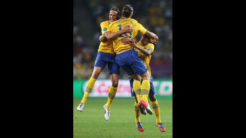Zlatan Ibrahimovic of Sweden celebrates his goal with Jonas Olsson, left, and Martin Olsson during the match between Sweden and France.