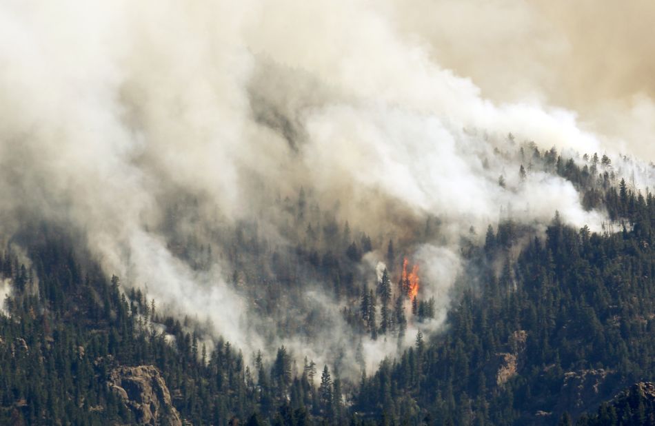 The High Park Fire rages west of Fort Collins on Monday. The blaze has ravaged more than 58,700 acres but is about 50% contained, authorities say.
