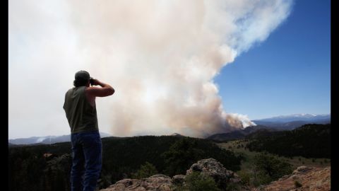Local resident Dwayne Crawford looks out at the High Park Fire from his home west of Fort Collins on June 19.