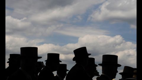 Top hats are worn by race-goers at the Royal Ascot in England on Wednesday, June 20. The five-day meeting is one of the highlights of the horse racing calendar and the season. Thousands of race fans are expected to attend.