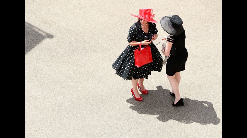 Two women chit-chat on day one of the races.
