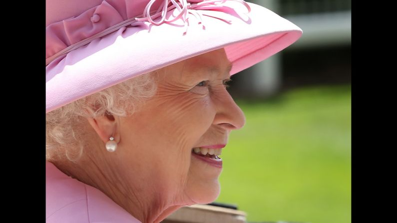 Queen Elizabeth II smiles as she arrives.