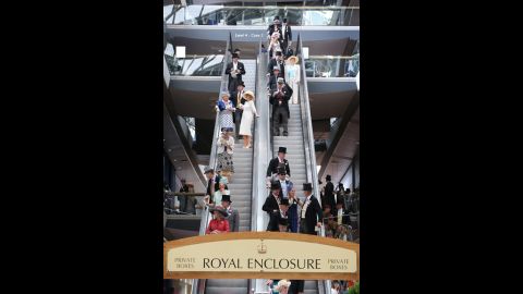 Race-goers ride an escalator down from the private boxes of the Royal Enclosure.