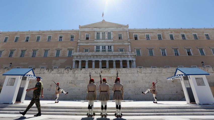 ATHENS, GREECE - JUNE 18: The Changing of the Guard ceremony takes place in front of the Greek Parliament building on June 18, 2012 in Athens, Greece. The conservative, pro-bailout New Democracy party came in first winning 130 of the 300 seats in Parliament. The Greek electorate went to the polls yesterday in a re-run of the general election after no combinations of political parties were able to form a coalition government. (Photo by Oli Scarff/Getty Images) 