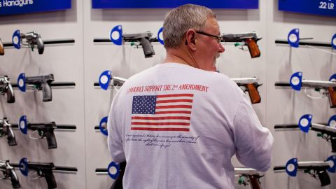 A gun enthusiast looks at a Smith & Wesson display at  NRA's annual meeting April 14 at America's Center in St. Louis. 