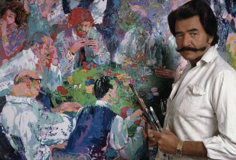 Iconic American artist LeRoy Neiman, seen here with his 1980 painting depicting gamblers, died in New York on Wednesday, June 20. He was 91.