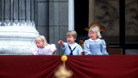From the balcony of Buckingham Palace, a young Prince William watches the Trooping of the Color in 1985 with Lady Gabriella Windsor, left, and Lady Zara Phillips.