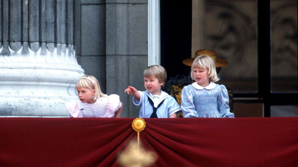 From the balcony of Buckingham Palace, a young Prince William watches the Trooping of the Colour in 1985. He is joined by Lady Gabriella Windsor, left, and Lady Zara Phillips.