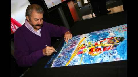 Artist LeRoy Nieman signs autographs at the 100 Days to Vancouver Celebration on November 4, 2009, at the Rockefeller Center in New York City.