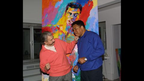 Muhammad Ali and  Neiman clown around during Ali's visit to Neiman's New York studio to see his newest serigraph "Muhammad Ali-Athlete of the Century" in 2001.