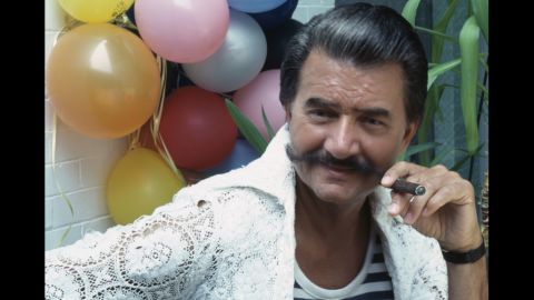 Neiman, known for his trademark handlebar mustache, smokes a cigar at an event in 1981.