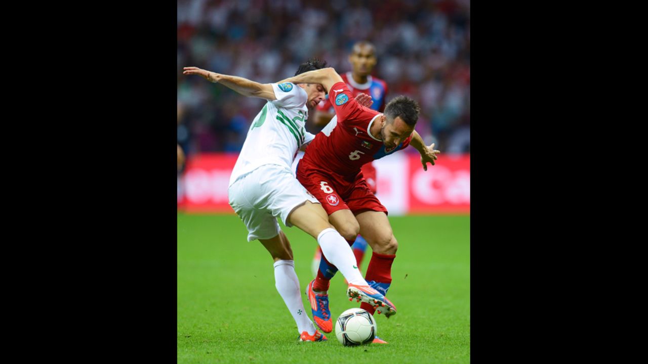 Helder Postiga of Portugal tackles Tomas Sivok of Czech Republic during the quarter-final match.