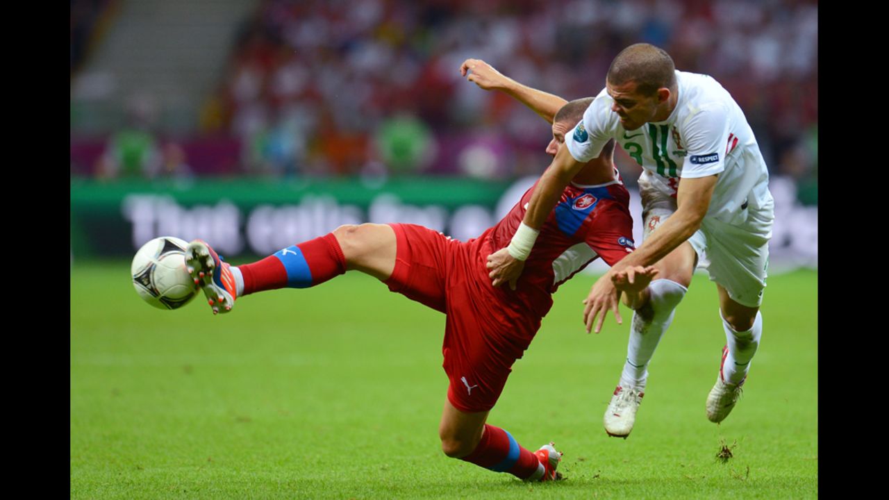 Jan Rezek of Czech Republic and Pepe of Portugal battle for the ball during the quarterfinal match between Czech Republic and Portugal on Thursday, June 21. 