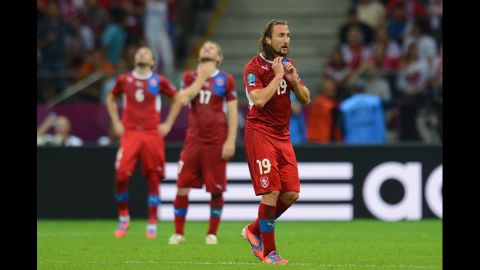 Petr Jiracek of the Czech Republic and teammates look dejected after conceding the opening goal to Portugal.