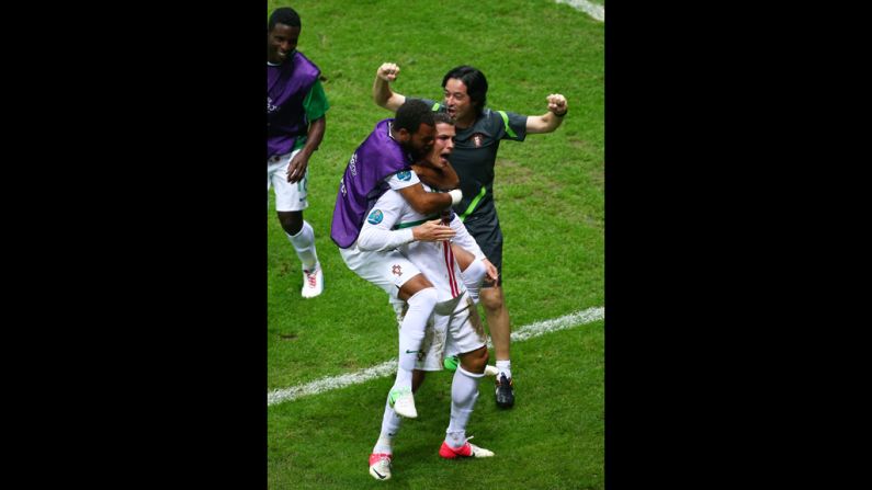 Portugal's Cristiano Ronaldo celebrates scoring the opening goal with his teammates during the quarter final match against the Czech Republic.