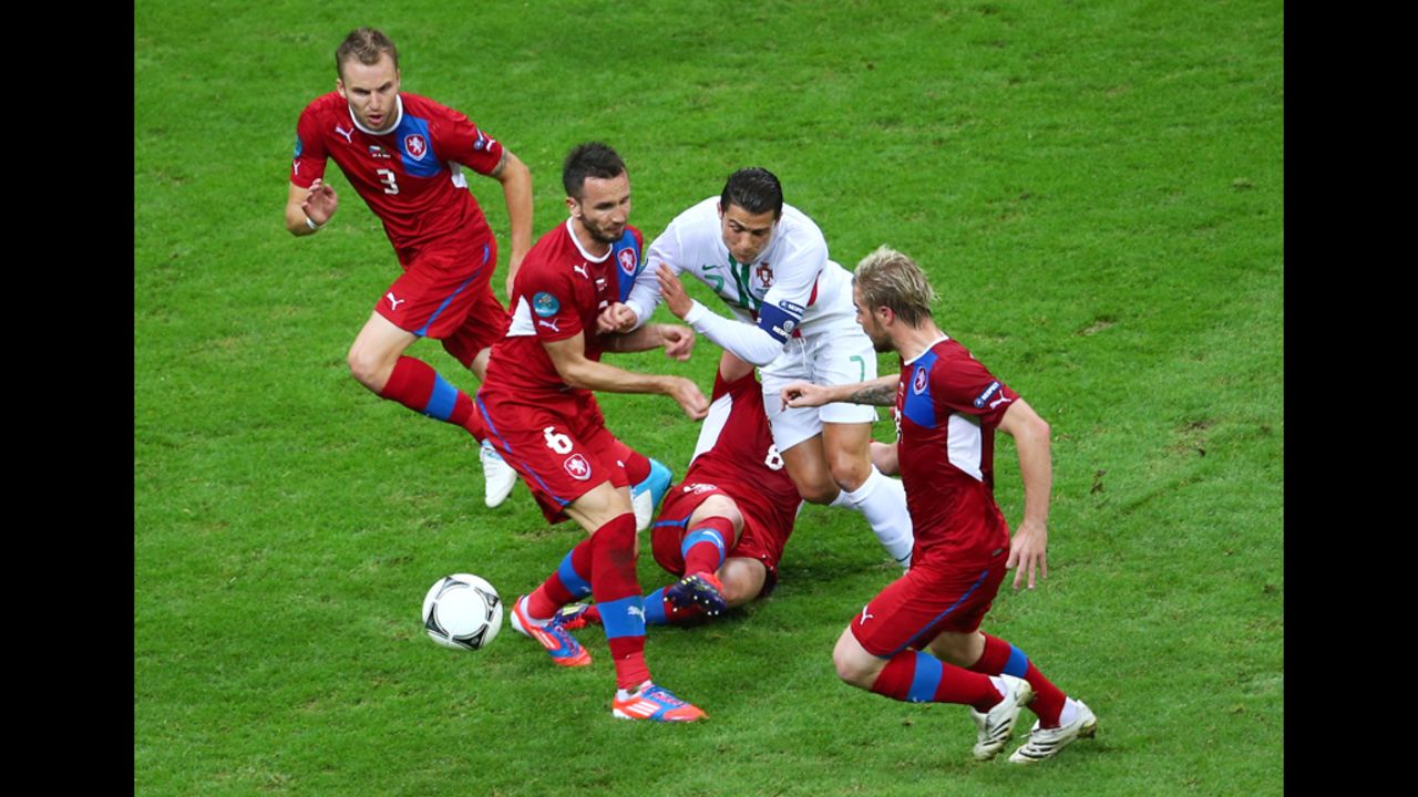 Tomas Sivok and David Limbersky of Czech Republic defend the attack of Portugal's Cristiano Ronaldo.