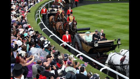 Queen Elizabeth II and Prince Philip, Duke of Edinburgh, and other members of the royal familly arrive in the Parade Ring at the Royal Ascot on Ladies Day on Thursday, June 21. Ladies Day is traditionally the fashion highlight of the five-day race meeting.