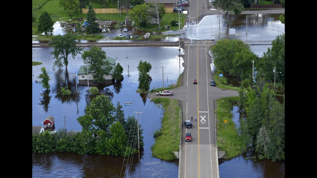 Travel remains difficult in parts of northeastern Minnesota after intense flash flooding. Here, the St. Louis River rises in Brookston, near Cloquet, on Thursday, June 21. 