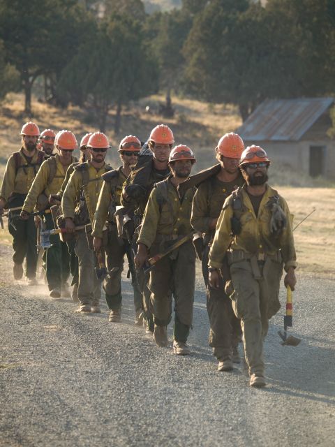 The Idaho City Hotshots firefighting team comes down after several nights battling Little Bear Fire in Lincoln National Forest in New Mexico on June 15.