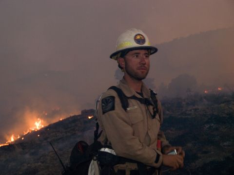 A firefighter battles the Little Bear Fire on June 14 at Lincoln National Forest.