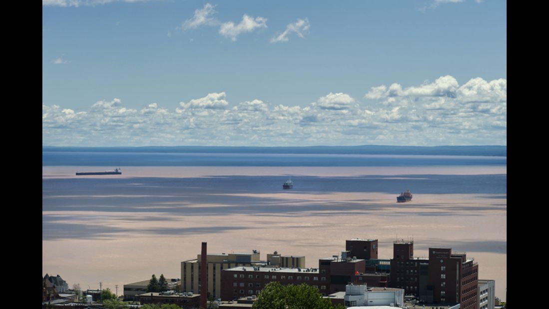 Flood runoff leaves mud in Lake Superior in this view looking east from Duluth toward Wisconsin. Heavy storms this week dropped as much as 10 inches of rain on Duluth and neighboring communities.