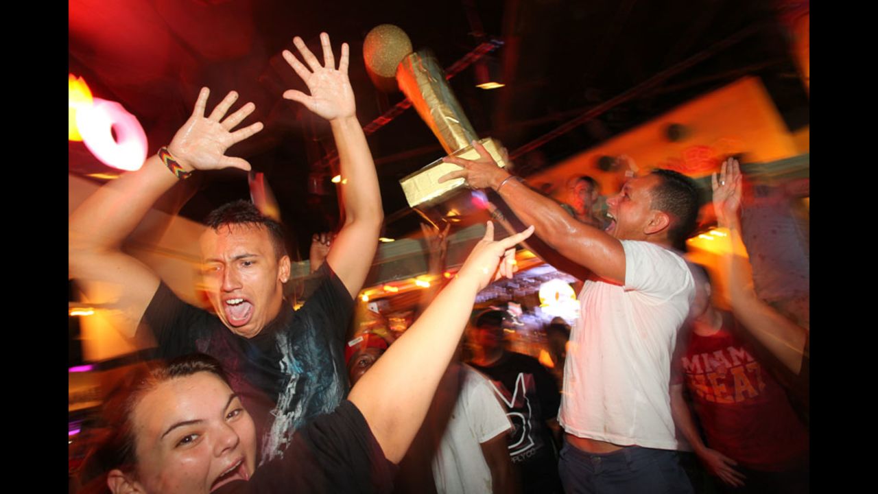Miami Heat fans celebrate the team's win over the Oklahoma City Thunder in the 2012 NBA Finals on Thursday, June 21 in Miami.
