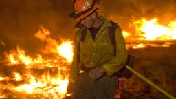 Photographer Kari Greer has spent years documenting wildfires and firefighters in much of the United States. In this photo, a firefighter works a low-intensity burn operation June 14 at Lincoln National Forest in New Mexico.