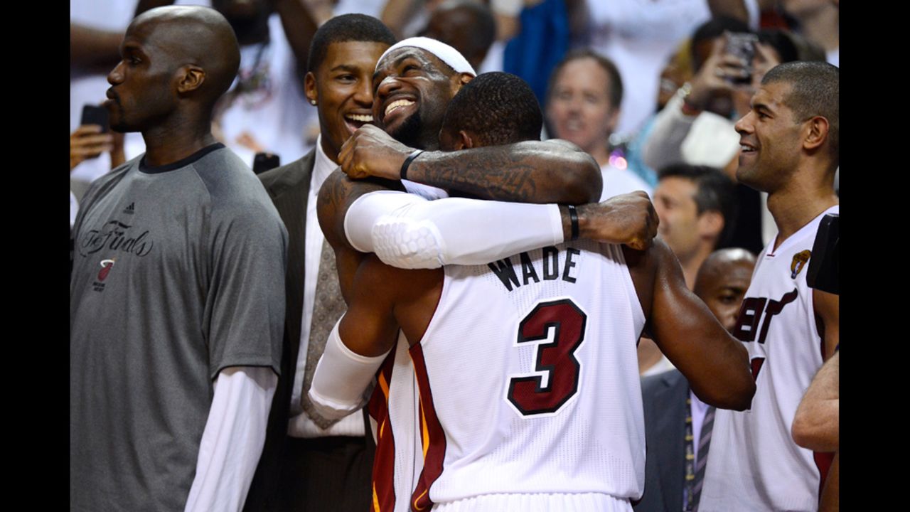 LeBron James No. 6 and Dwyane Wade No. 3 of the Heat celebrate late in the fourth quarter against the Thunder.