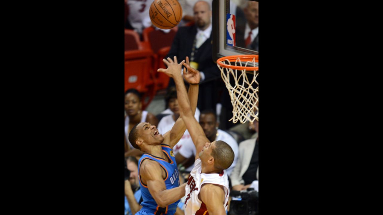 Shane Battier, right, of the Heat and Russell Westbrook, left, of the Thunder vie for the ball.