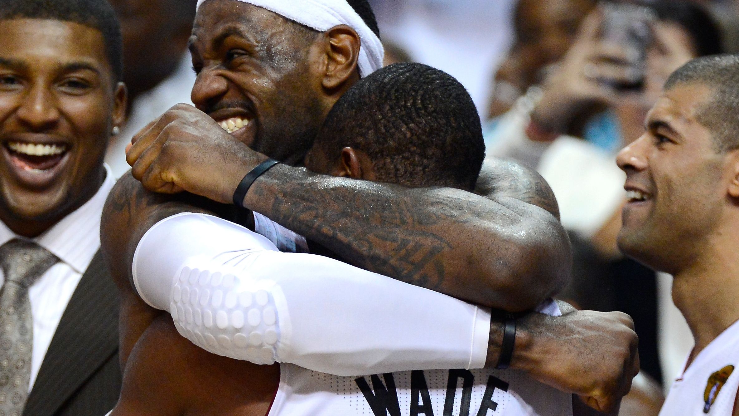 MVP LeBron James hugs teammate Dwyane Wade after finally winning an NBA Championship ring.