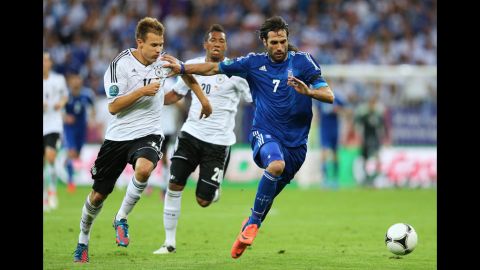 Germany's Holger Badstuber chases down Greece's Georgios Samaras during the Euro 2012 quarterfinal match at the Municipal Stadium in Gdansk, Poland.