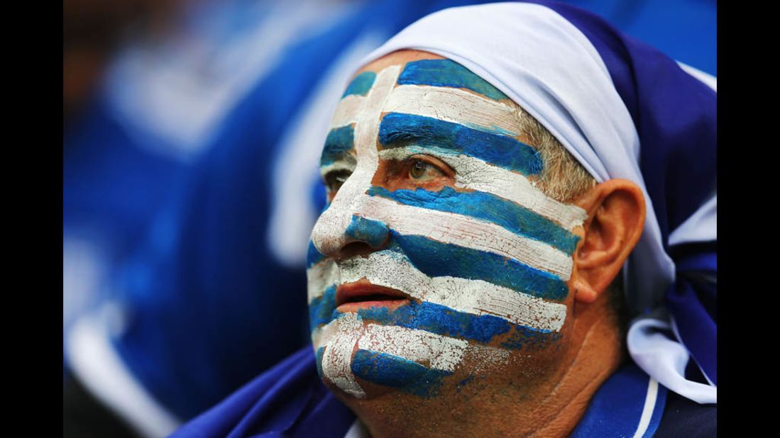A Greek fan watches the quarterfinal match against Germany on Friday.