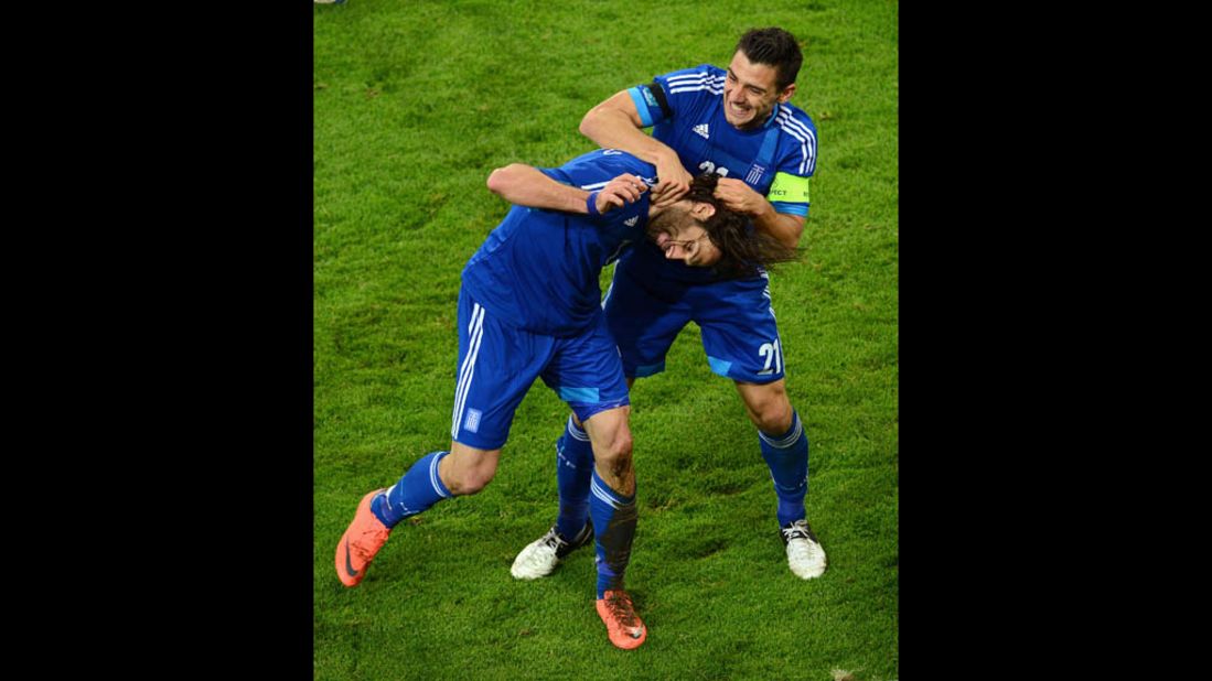 Georgios Samaras and Kostas Katsouranis celebrate scoring a goal that tied their game against Germany, 1-1, during a quarterfinal match at Euro 2012 in Gdansk, Poland.