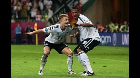 Germany's Marco Reus celebrates scoring the team's fourth goal with Jerome Boateng during the Euro 2012 quarter-final match against Greece at The Municipal Stadium in Gdansk, Poland.