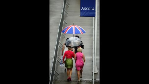 Rain falls on the race-goers attending the Royal Ascot.