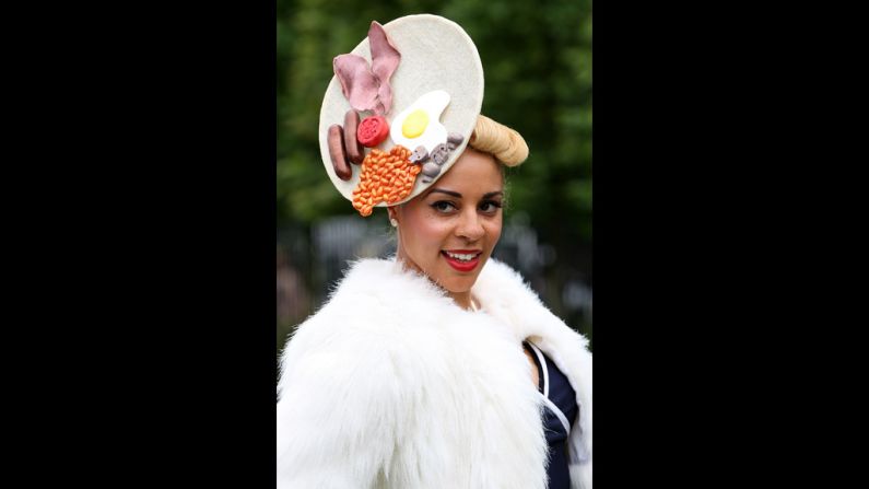 A woman shows off her unusual hat.