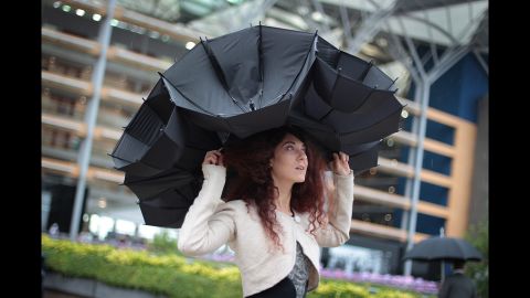 Larisa Katz shows off an umbrella hat design at Royal Ascot.