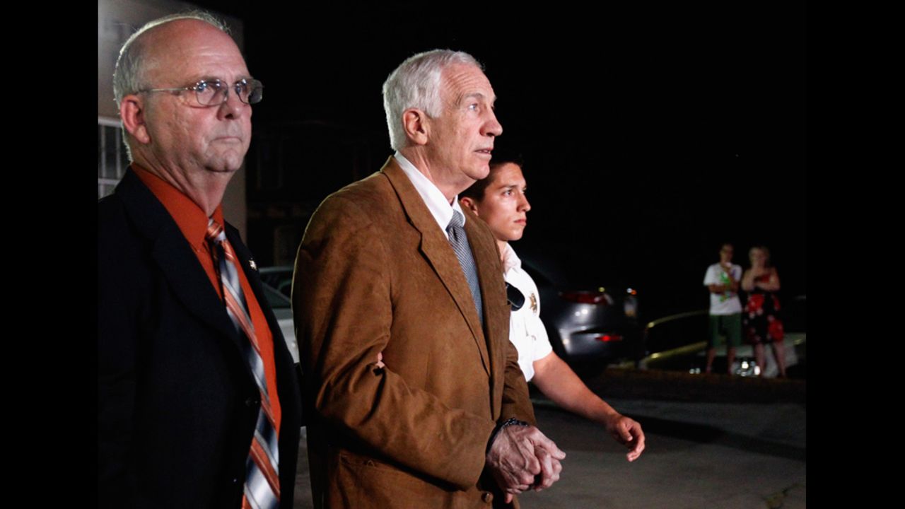 Former Penn State assistant football coach Jerry Sandusky leaves the Centre County Courthouse in handcuffs after a jury found him guilty in his sex abuse trial on Friday, June 22.