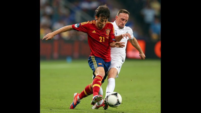 Franck Ribery of France challenges David Silva of Spain.