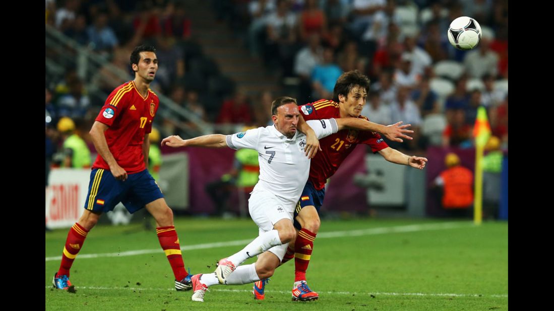 Franck Ribery of France and David Silva of Spain challenge for the ball.